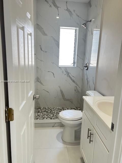 922 Northwest 2nd Street, Unit 4 Miami, FL 33128 - Photo 31 of 35 a bathroom with a sink toilet and shower