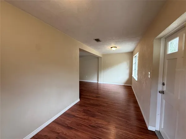 a view of gallery with wooden floor