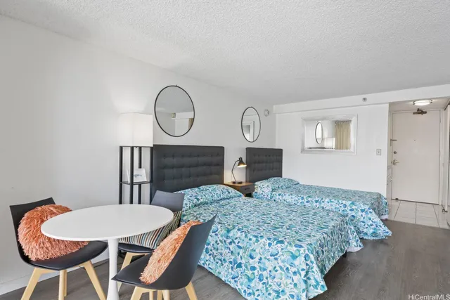 a view of a livingroom with furniture and wooden floor