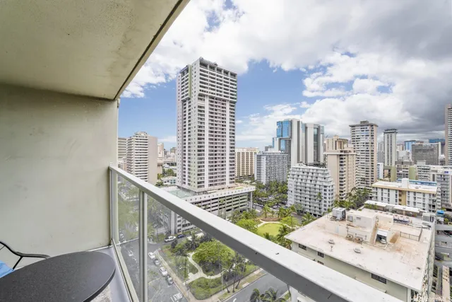 a view of balcony with a large window and wooden floor