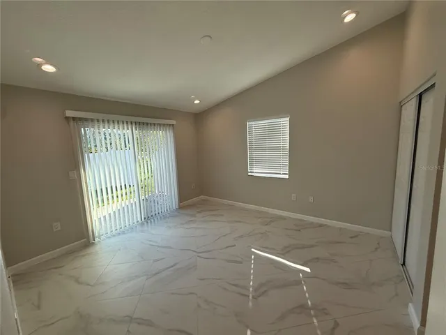 a view of an empty room with a window