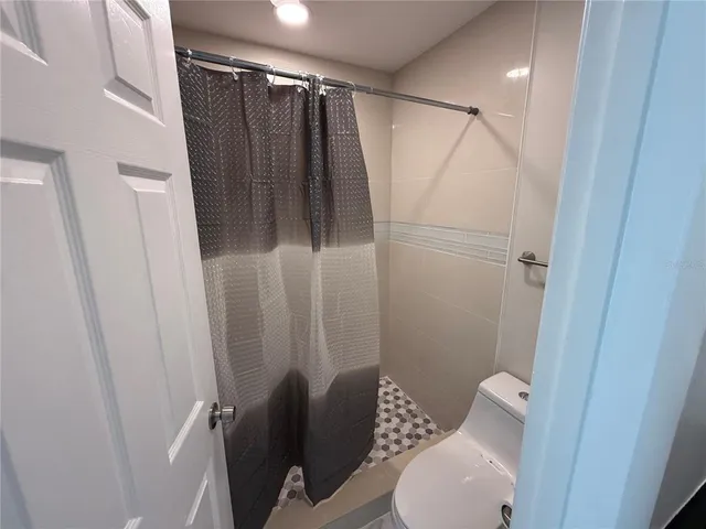 a room with a mirror and a sink