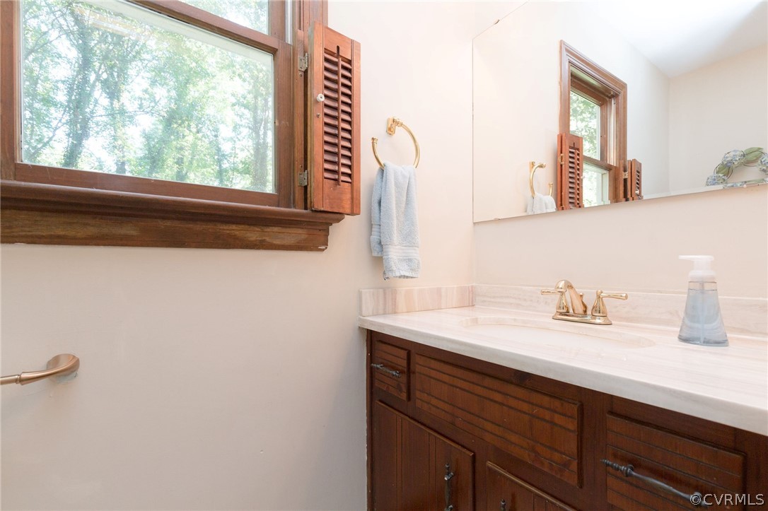 13904 2 Notch Road Midlothian, VA 23112 - Photo 25 of 48 a bathroom with a sink and a mirror