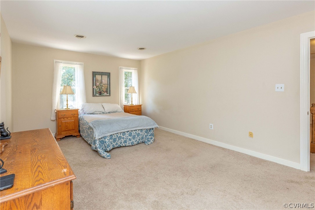13904 2 Notch Road Midlothian, VA 23112 - Photo 28 of 48 a bedroom with a bed and a couch