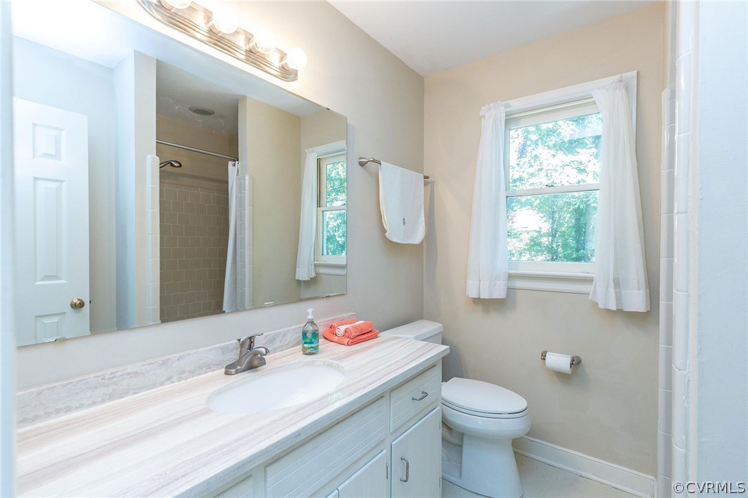 13904 2 Notch Road Midlothian, VA 23112 - Photo 30 of 48 a bathroom with a granite countertop sink mirror and toilet