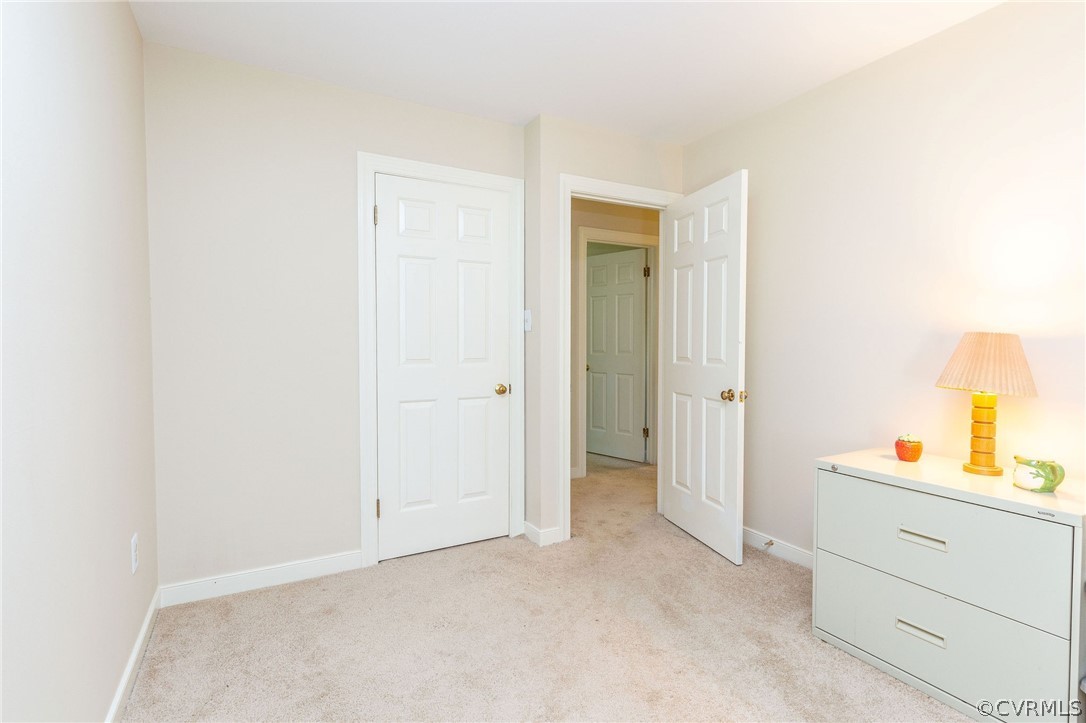 13904 2 Notch Road Midlothian, VA 23112 - Photo 42 of 48 a room with a closet and mirror