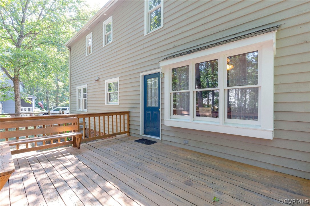 13904 2 Notch Road Midlothian, VA 23112 - Photo 45 of 48 a view of a balcony with wooden floor and fence