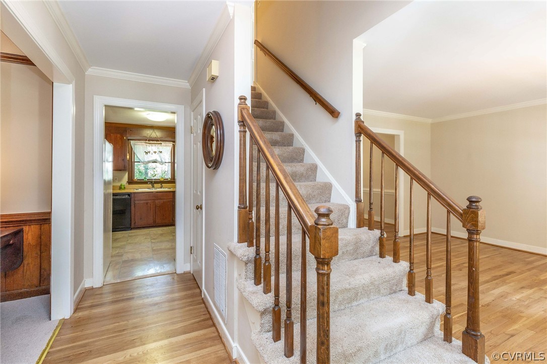 13904 2 Notch Road Midlothian, VA 23112 - Photo 8 of 48 a view of a hallway with wooden floor and staircase
