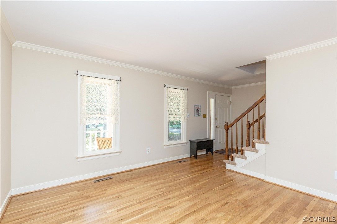 13904 2 Notch Road Midlothian, VA 23112 - Photo 9 of 48 a view of an empty room with wooden floor and a window