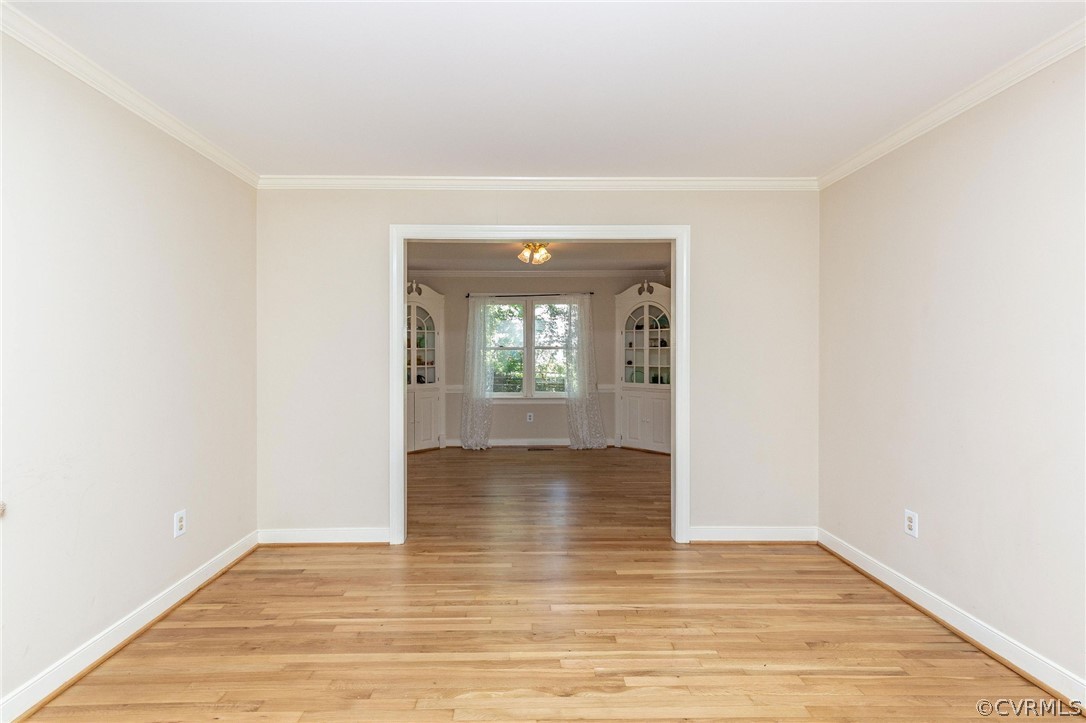 13904 2 Notch Road Midlothian, VA 23112 - Photo 10 of 48 an empty room with wooden floor and windows