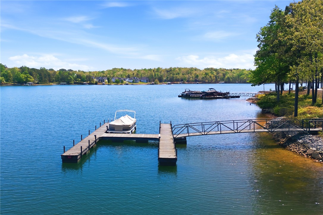578 Sunset Point Drive West Union, SC 29696 - Photo 35 of 46 This tranquil waterfront setting includes a private dock, offering direct access to the expansive lake.