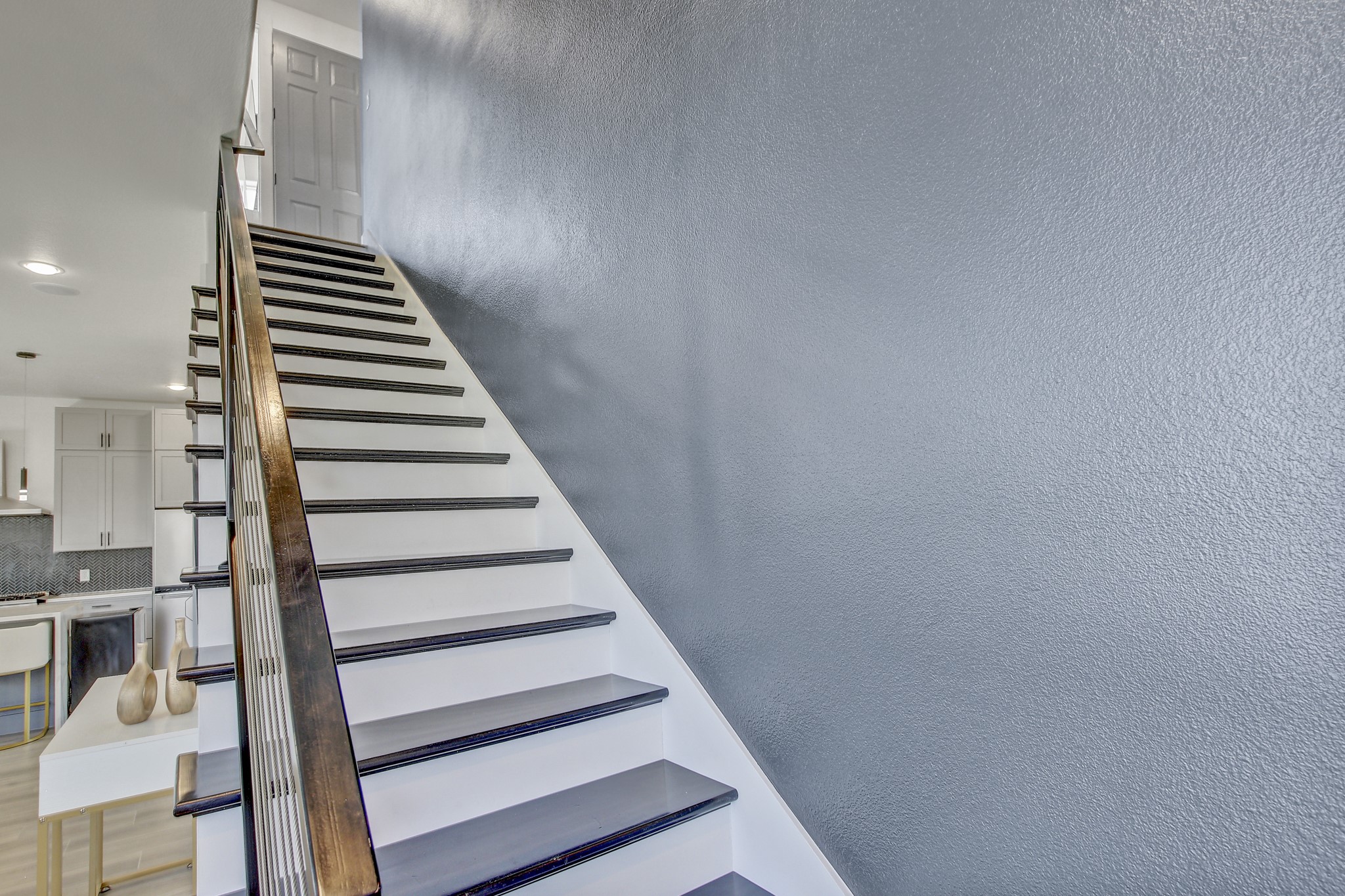 4703 Louis Avenue, Unit A Austin, TX 78721 - Photo 18 of 35 Stairs with a textured wall and recessed lighting
