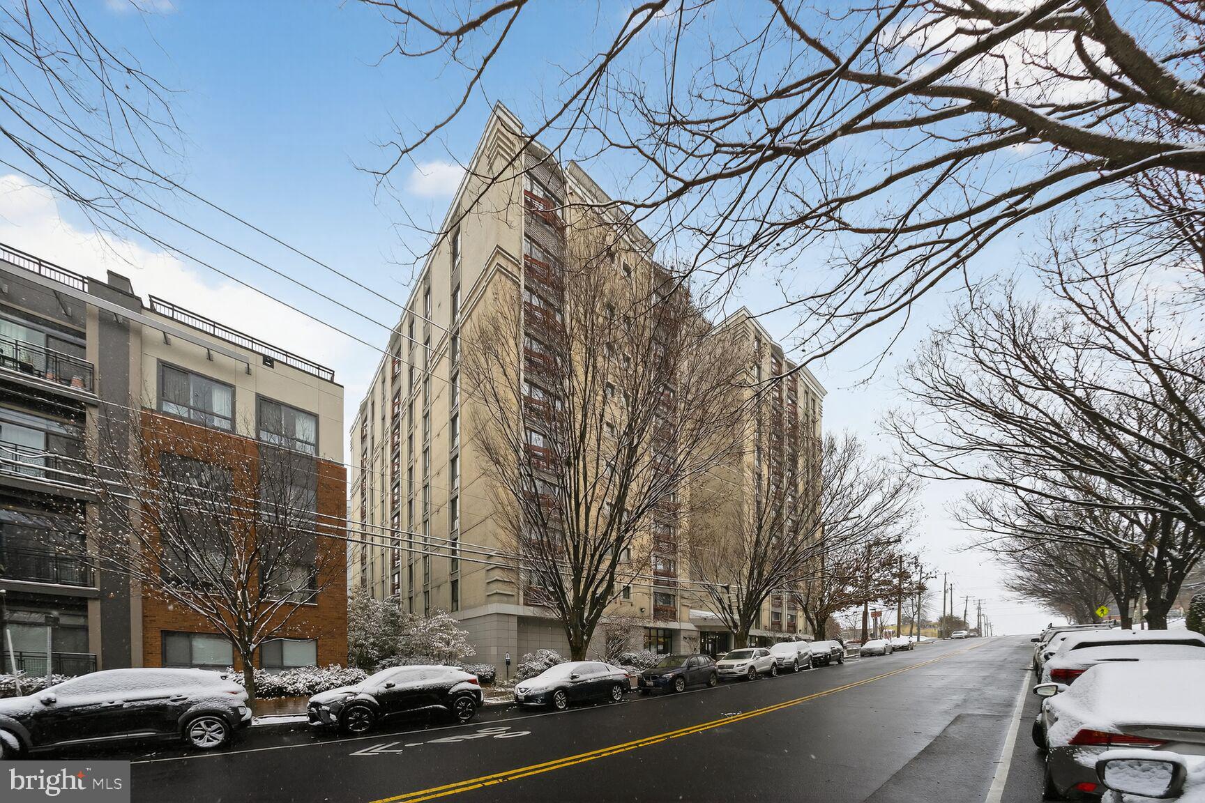 7923 Eastern Avenue Northwest, Unit 404 Silver Spring, MD 20910 - Photo 2 of 18 a view of a street with a cars parked on the road