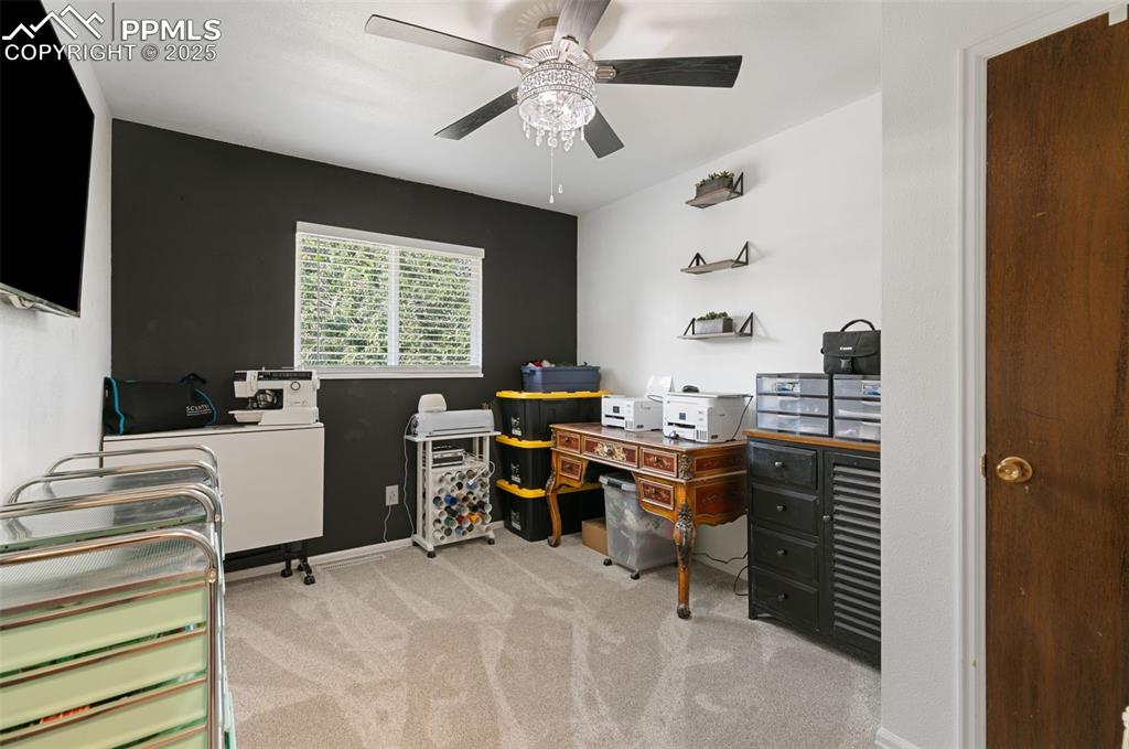 1921 Van Diest Road Colorado Springs, CO 80915 - Photo 21 of 45 Office area with light carpet and ceiling fan