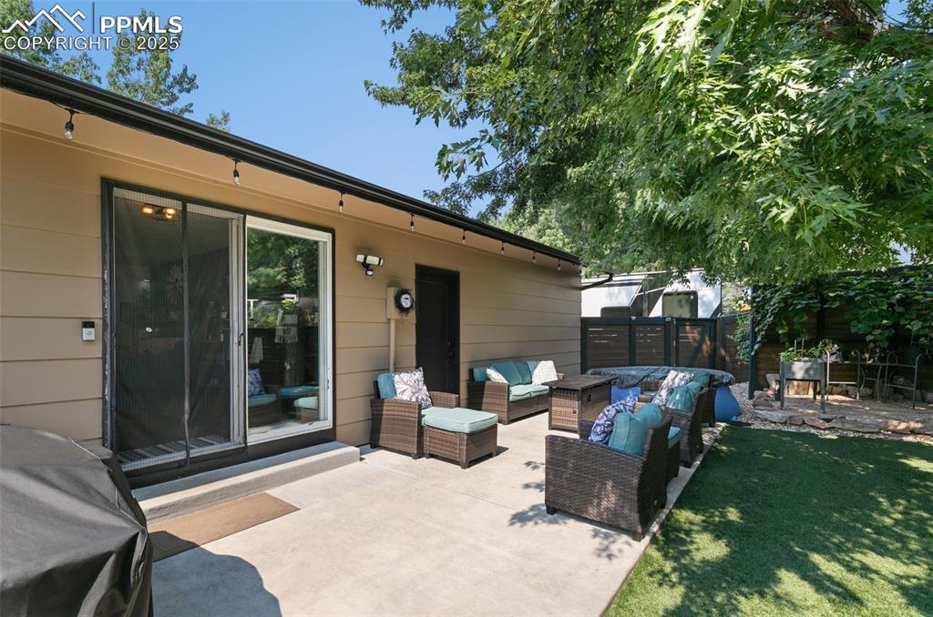 1921 Van Diest Road Colorado Springs, CO 80915 - Photo 24 of 45 Fenced backyard featuring a patio and an outdoor hangout area