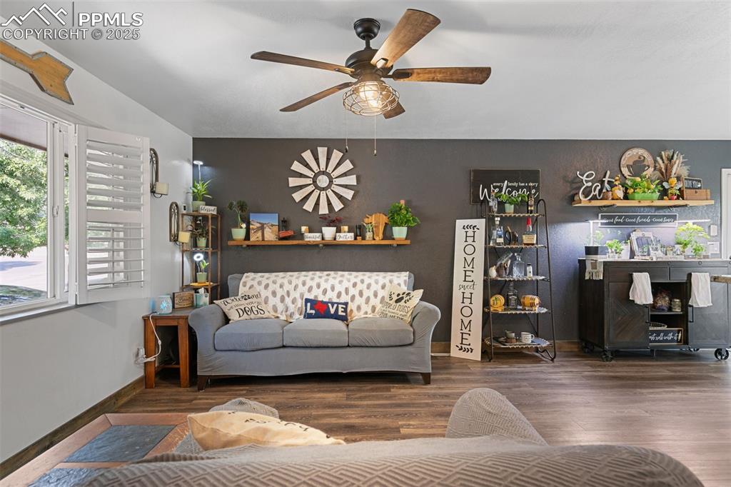 1921 Van Diest Road Colorado Springs, CO 80915 - Photo 31 of 45 Living area featuring wood finished floors and ceiling fan