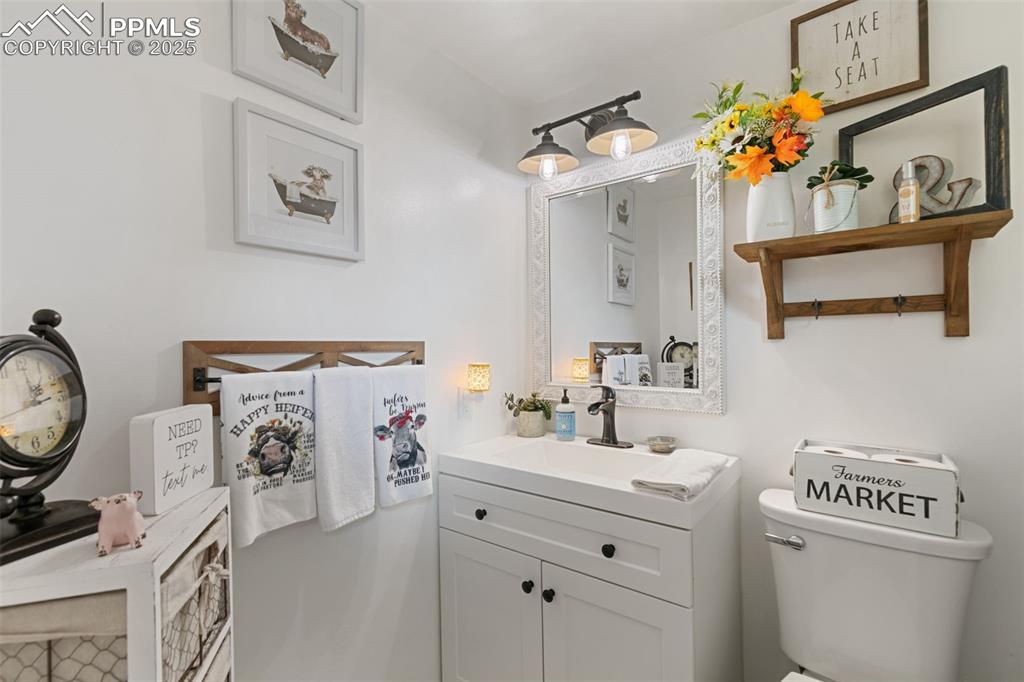 1921 Van Diest Road Colorado Springs, CO 80915 - Photo 36 of 45 Half bathroom with vanity and toilet