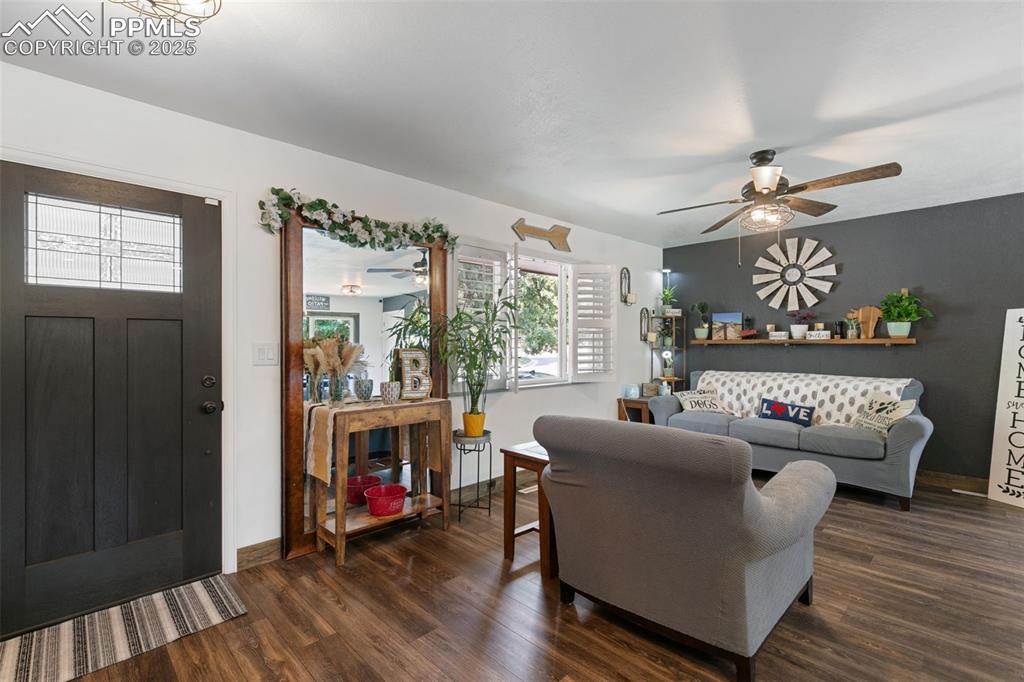 1921 Van Diest Road Colorado Springs, CO 80915 - Photo 5 of 45 Living area featuring dark wood finished floors and a ceiling fan