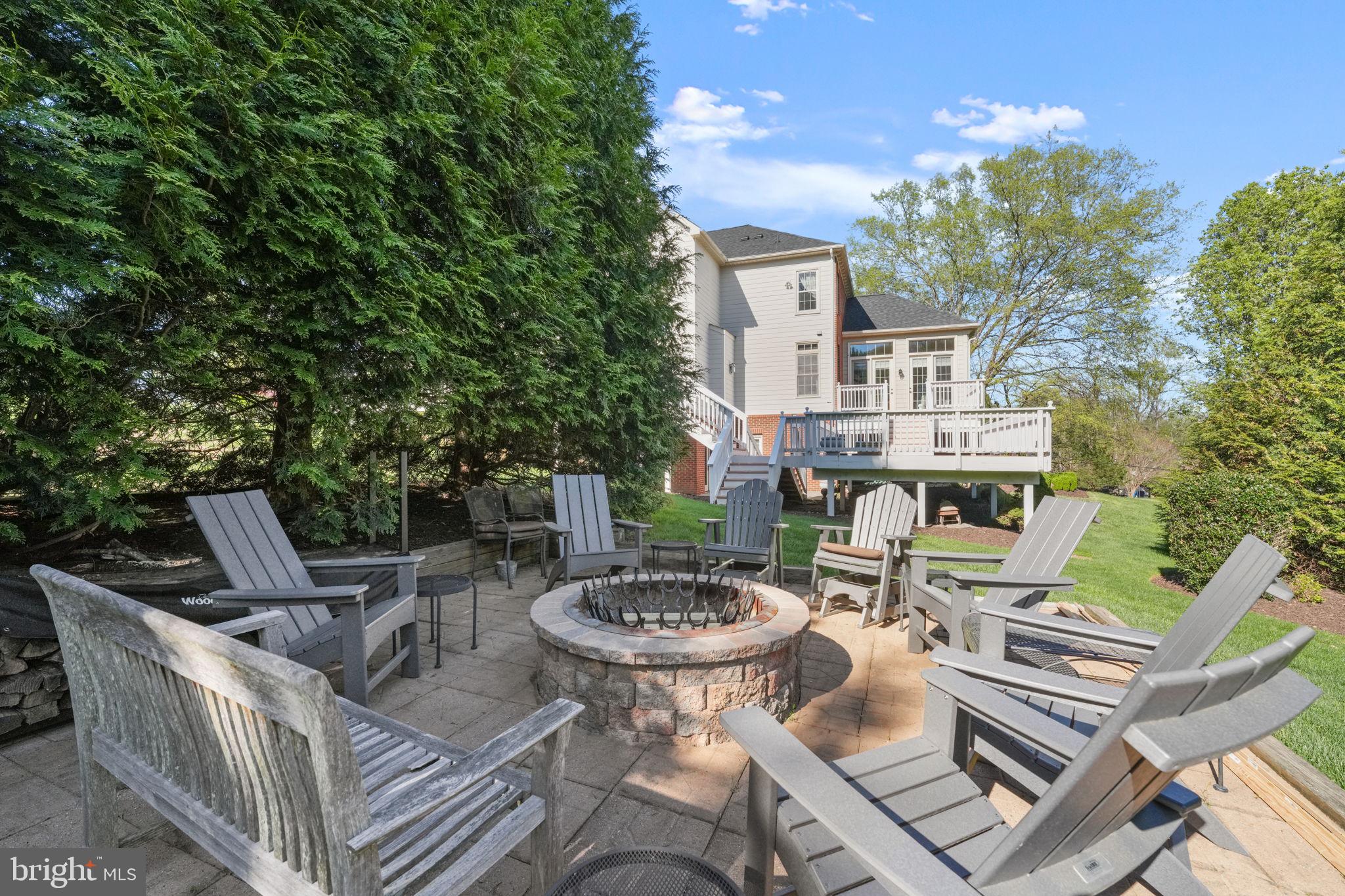 11431 Woolington Road Great Falls, VA 22066 - Photo 45 of 49 a view of a patio with table and chairs and potted plants