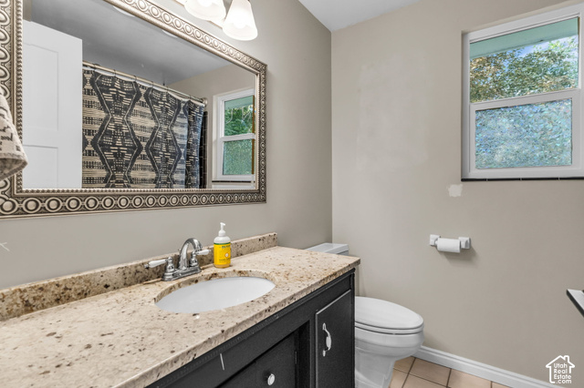 1073 Pineridge Road Sandy, UT 84094 - Photo 20 of 31 Vanity with a granite countertop, undermount sink, and chrome faucet