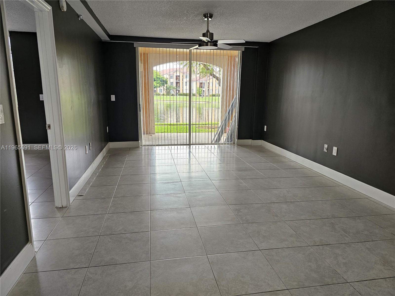 2051 Renaissance Boulevard, Unit 104 Miramar, FL 33025 - Photo 16 of 39 a view of an empty room and a window