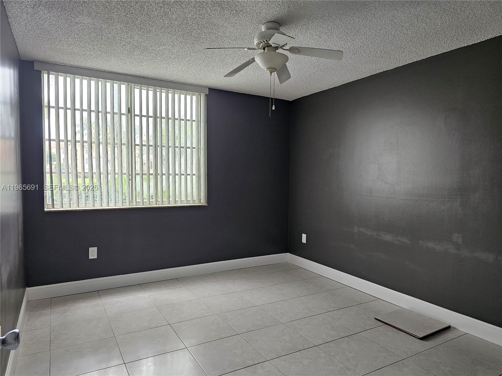 2051 Renaissance Boulevard, Unit 104 Miramar, FL 33025 - Photo 19 of 39 a view of an empty room with a window