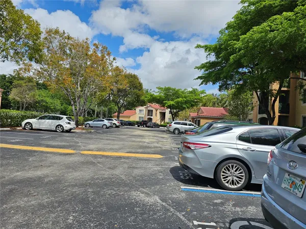 a view of street with parked cars
