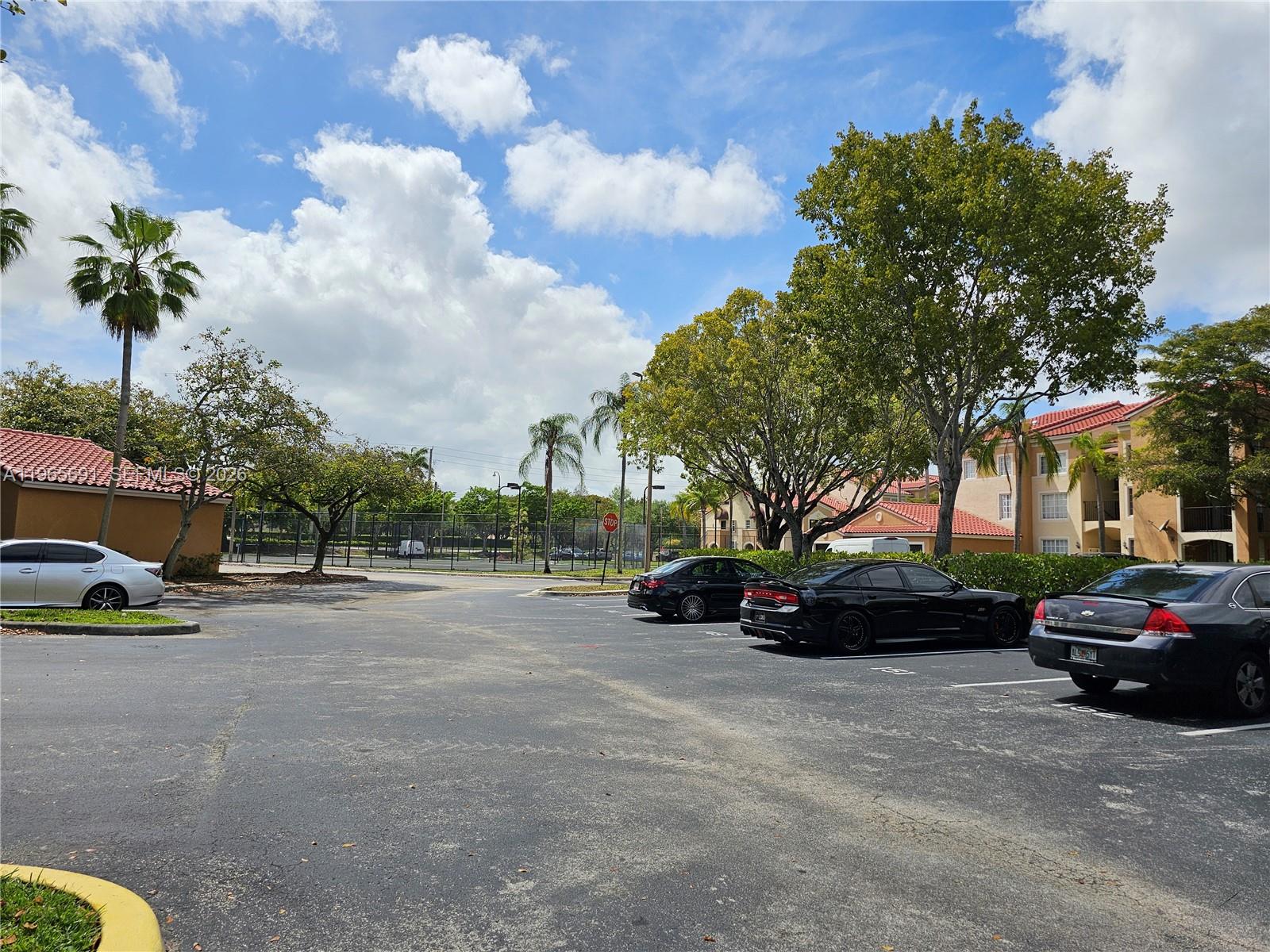 2051 Renaissance Boulevard, Unit 104 Miramar, FL 33025 - Photo 7 of 39 a view of street with parked cars