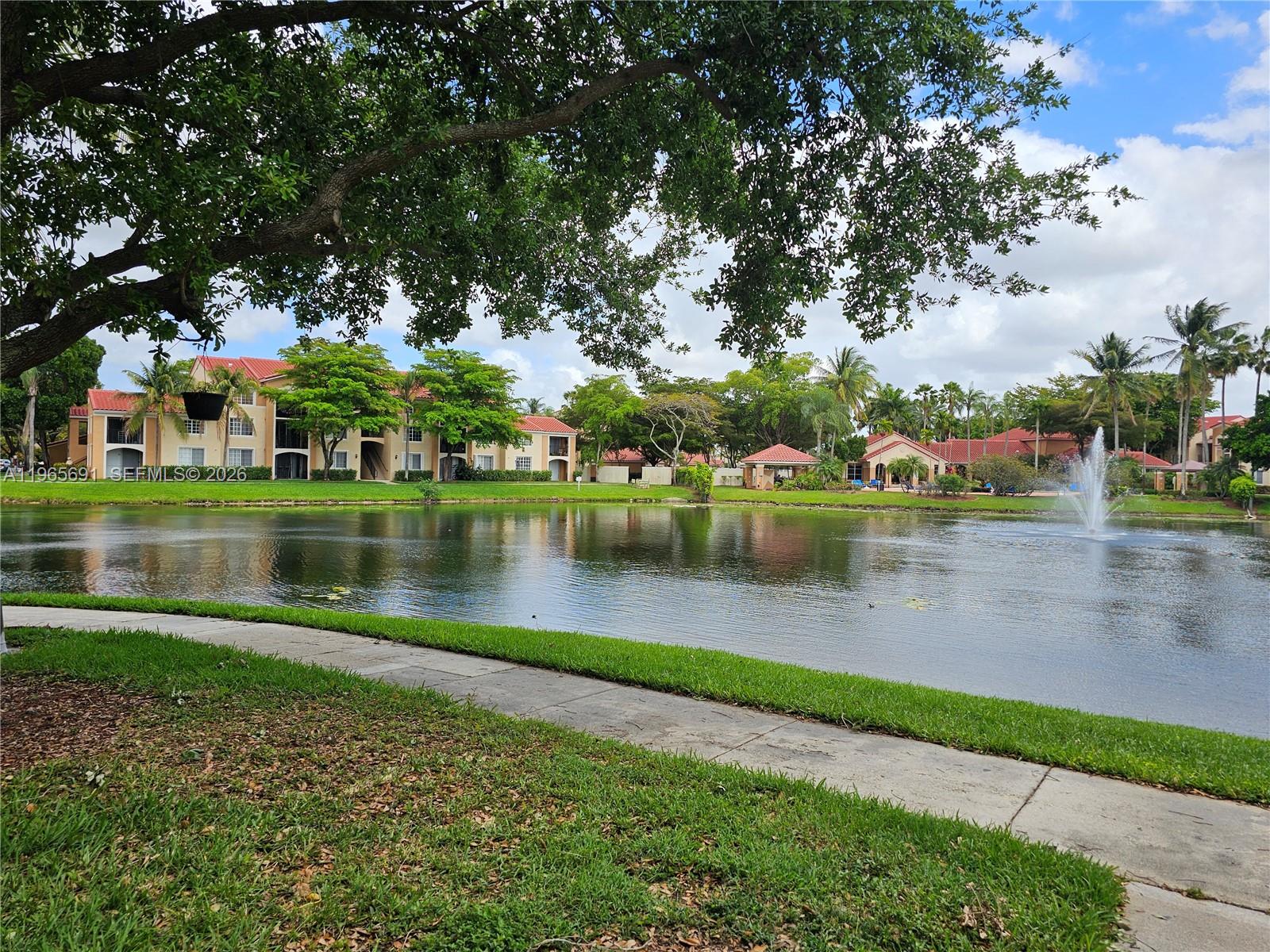 2051 Renaissance Boulevard, Unit 104 Miramar, FL 33025 - Photo 10 of 39 a view of a lake with houses