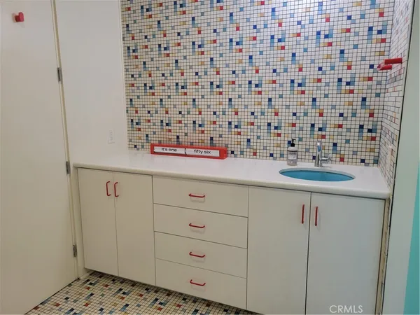 a bathroom with a sink and a shower