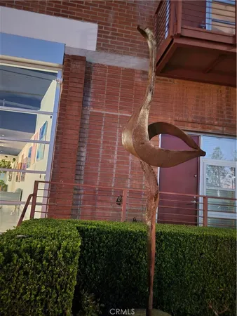 a view of a brick building with a small yard