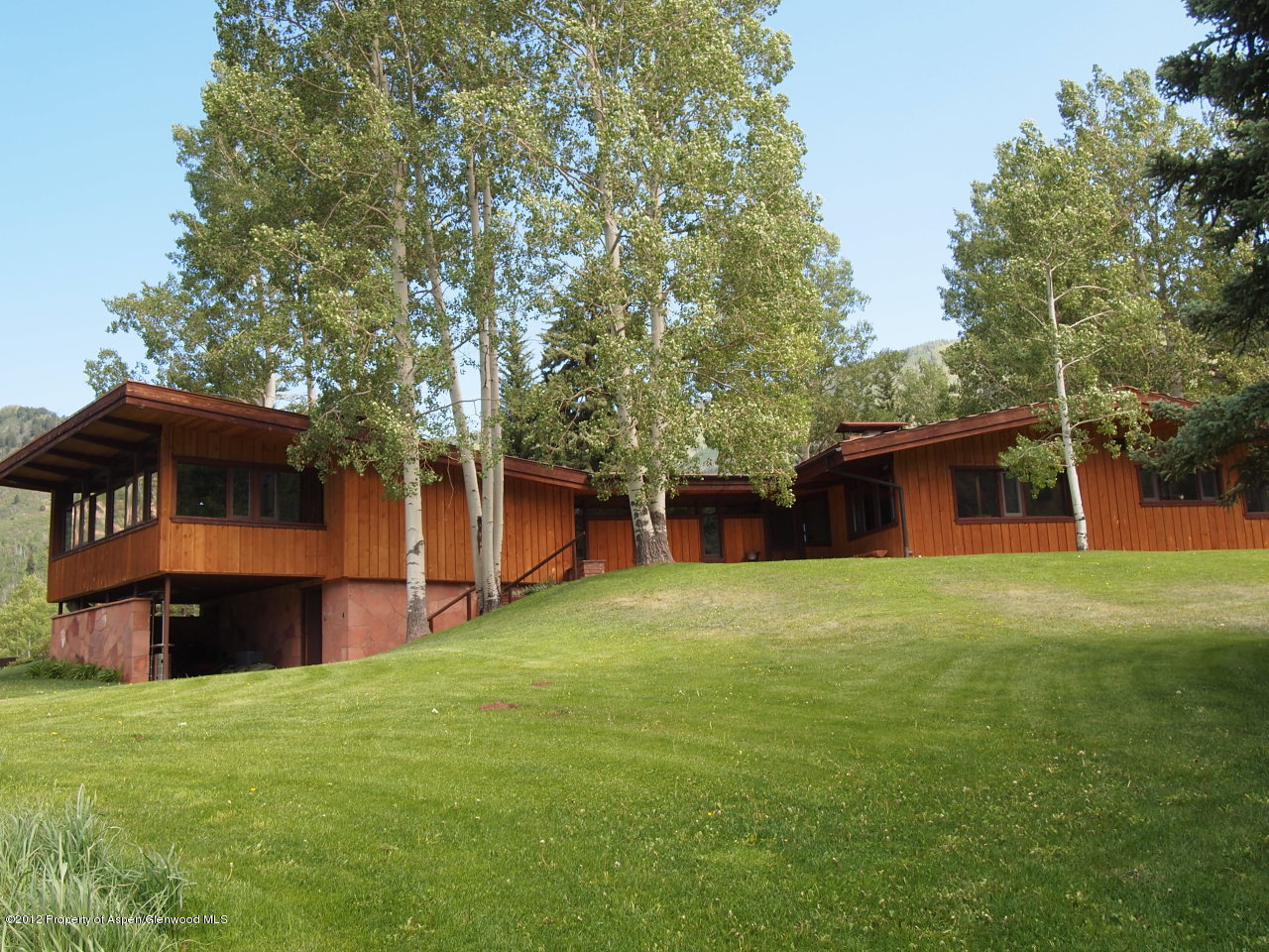 2900 Taylor Creek Road Basalt, CO 81621 - Photo 14 of 39 a front view of a house with a garden