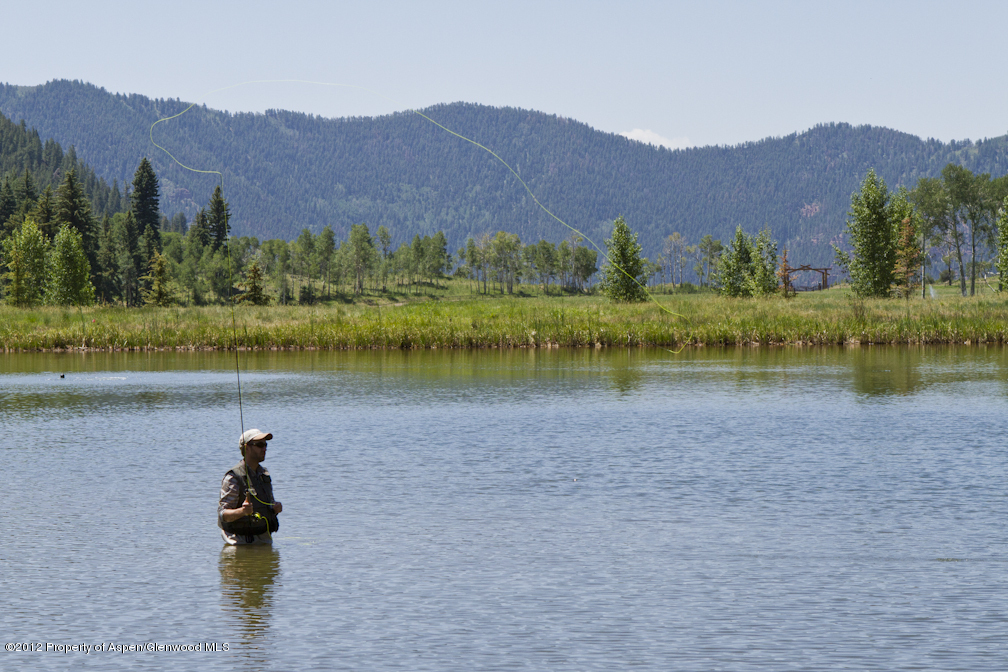 2900 Taylor Creek Road Basalt, CO 81621 - Photo 30 of 39 a view of a lake with a mountain in the background