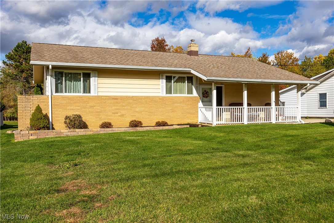 20114 Drake Road Strongsville, OH 44149 - Photo 2 of 35 Ranch-style house featuring brick siding, a front lawn, roof with shingles, and a chimney