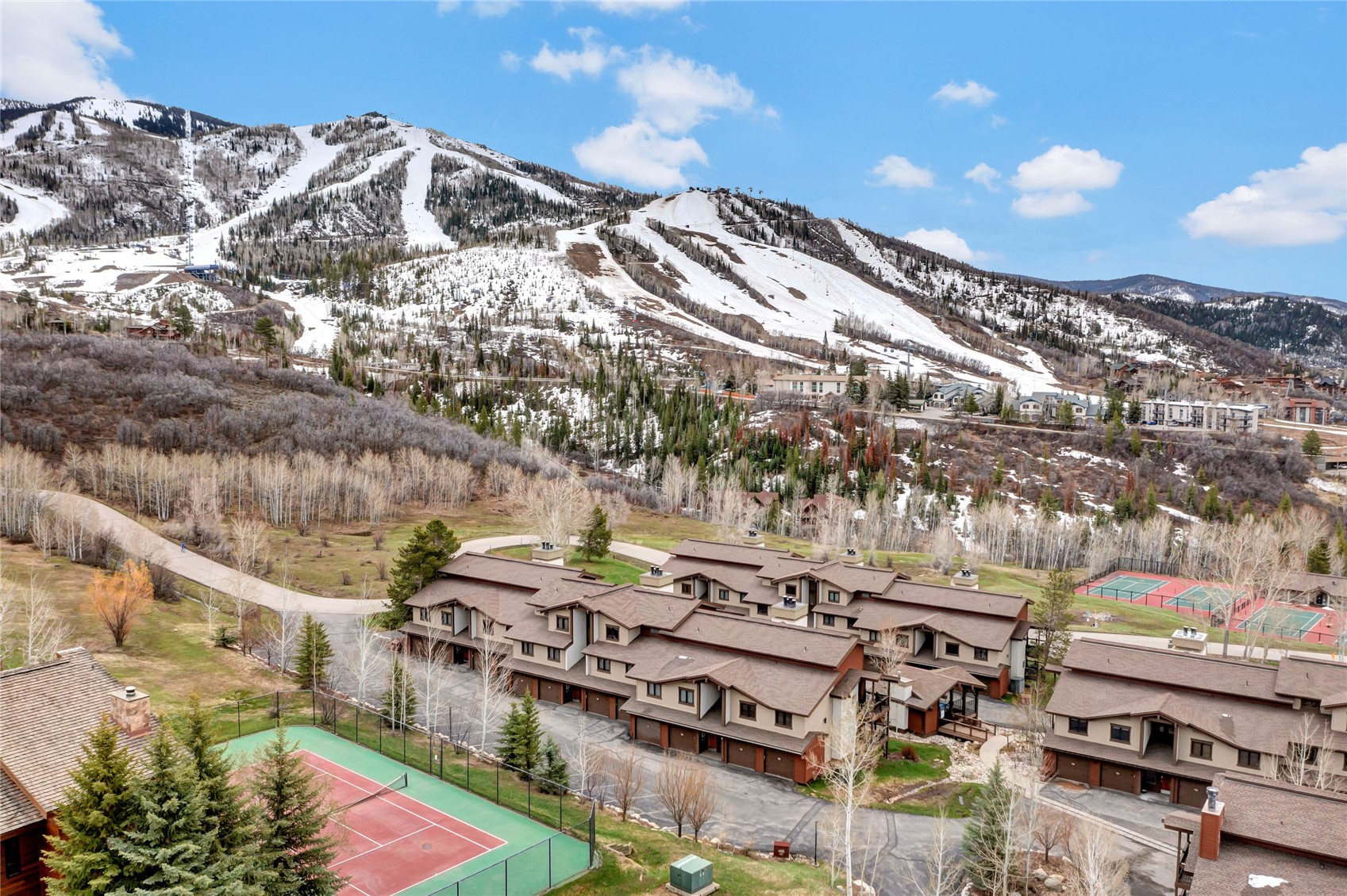 1700 Ranch Road, Unit 215 Steamboat Springs, CO 80487 - Photo 45 of 47 front of 200 building ski area in background
