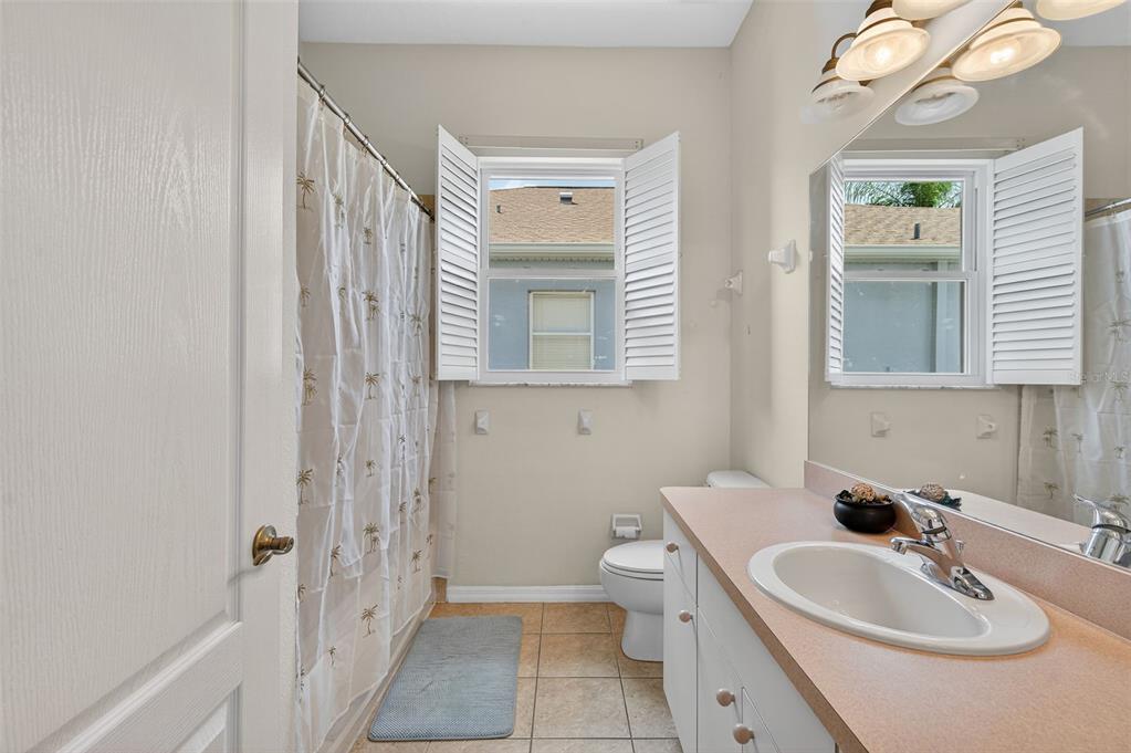 11501 Bloomington Court New Port Richey, FL 34654 - Photo 24 of 71 a bathroom with a sink and a mirror