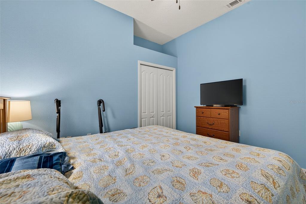 11501 Bloomington Court New Port Richey, FL 34654 - Photo 26 of 71 a bedroom with two bed and a tv