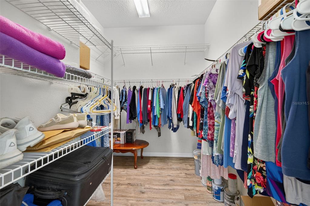 11501 Bloomington Court New Port Richey, FL 34654 - Photo 54 of 71 a view of walk in closet with clothes and shoes