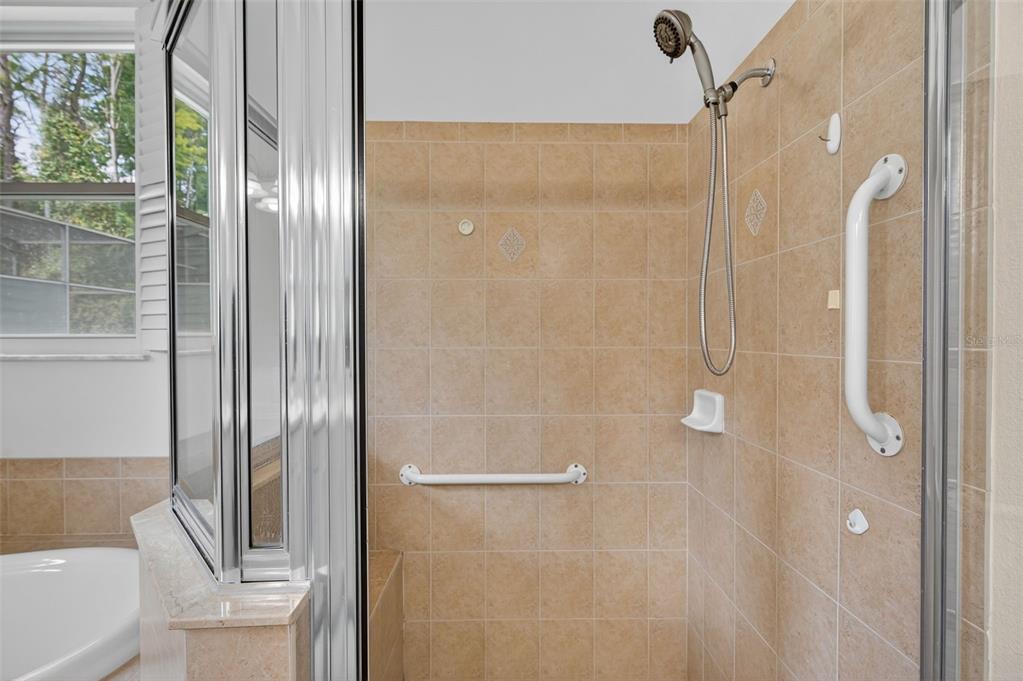 11501 Bloomington Court New Port Richey, FL 34654 - Photo 57 of 71 a bathroom with a glass shower door