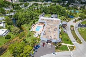 11501 Bloomington Court New Port Richey, FL 34654 - Photo 66 of 71 an aerial view of residential house with outdoor space and parking