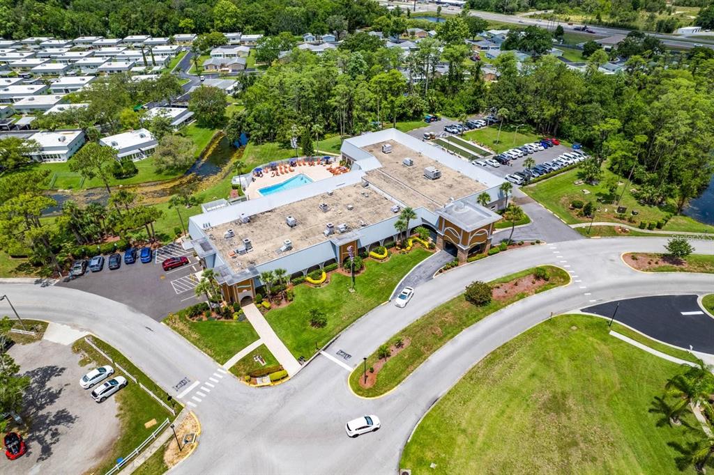 11501 Bloomington Court New Port Richey, FL 34654 - Photo 67 of 71 an aerial view of a swimming pool with a yard and outdoor seating