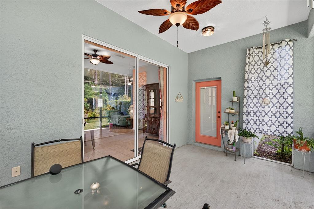 11501 Bloomington Court New Port Richey, FL 34654 - Photo 10 of 71 a view of a livingroom with furniture and a ceiling fan