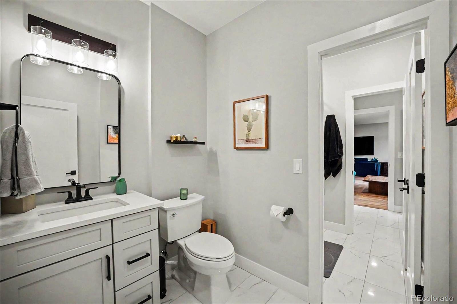 7231 Timber Trail Road Evergreen, CO 80439 - Photo 20 of 35 a bathroom with a toilet sink and shower