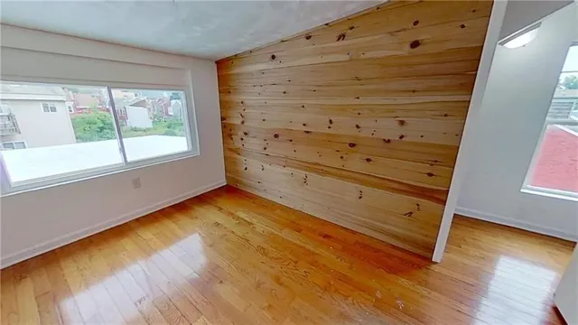 a view of walk in closet with empty room