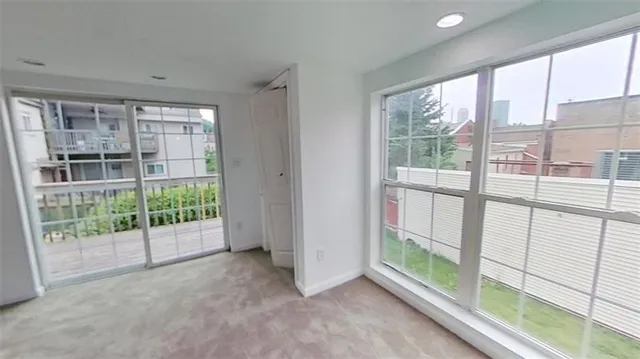 a view of a room with sliding glass door