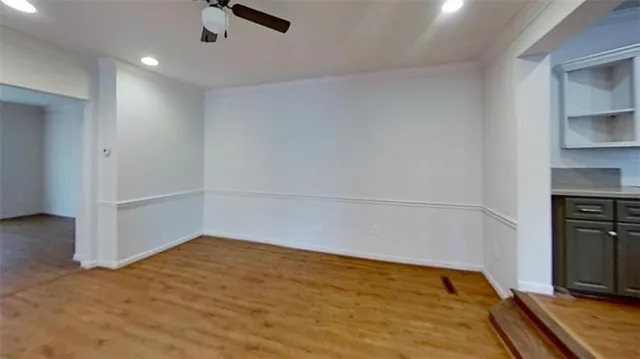 wooden floor in an empty room with a fireplace