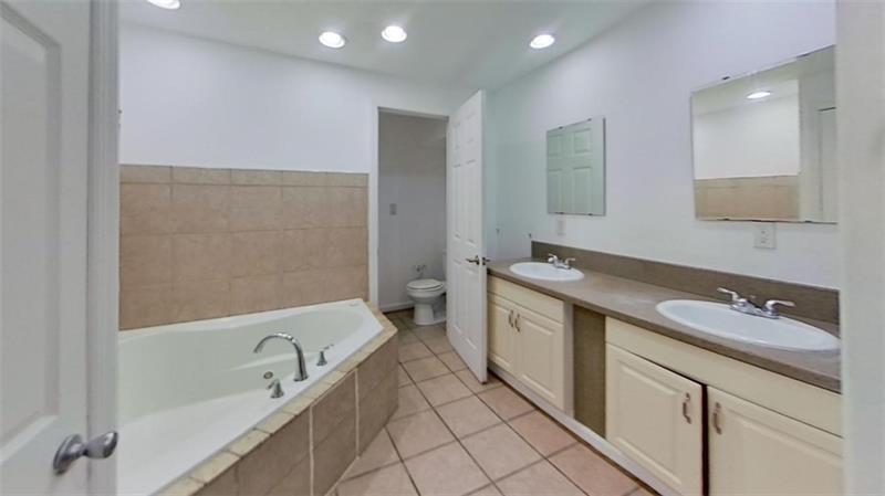 120 South 12th Street Pittsburgh, PA 15203 - Photo 10 of 19 a spacious bathroom with a sink and mirror