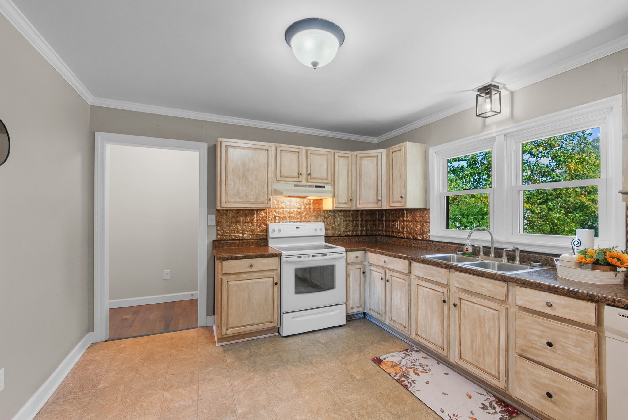 415 South Ingram Street Pulaski, TN 38478 - Photo 11 of 33 a kitchen with a stove a sink and cabinets
