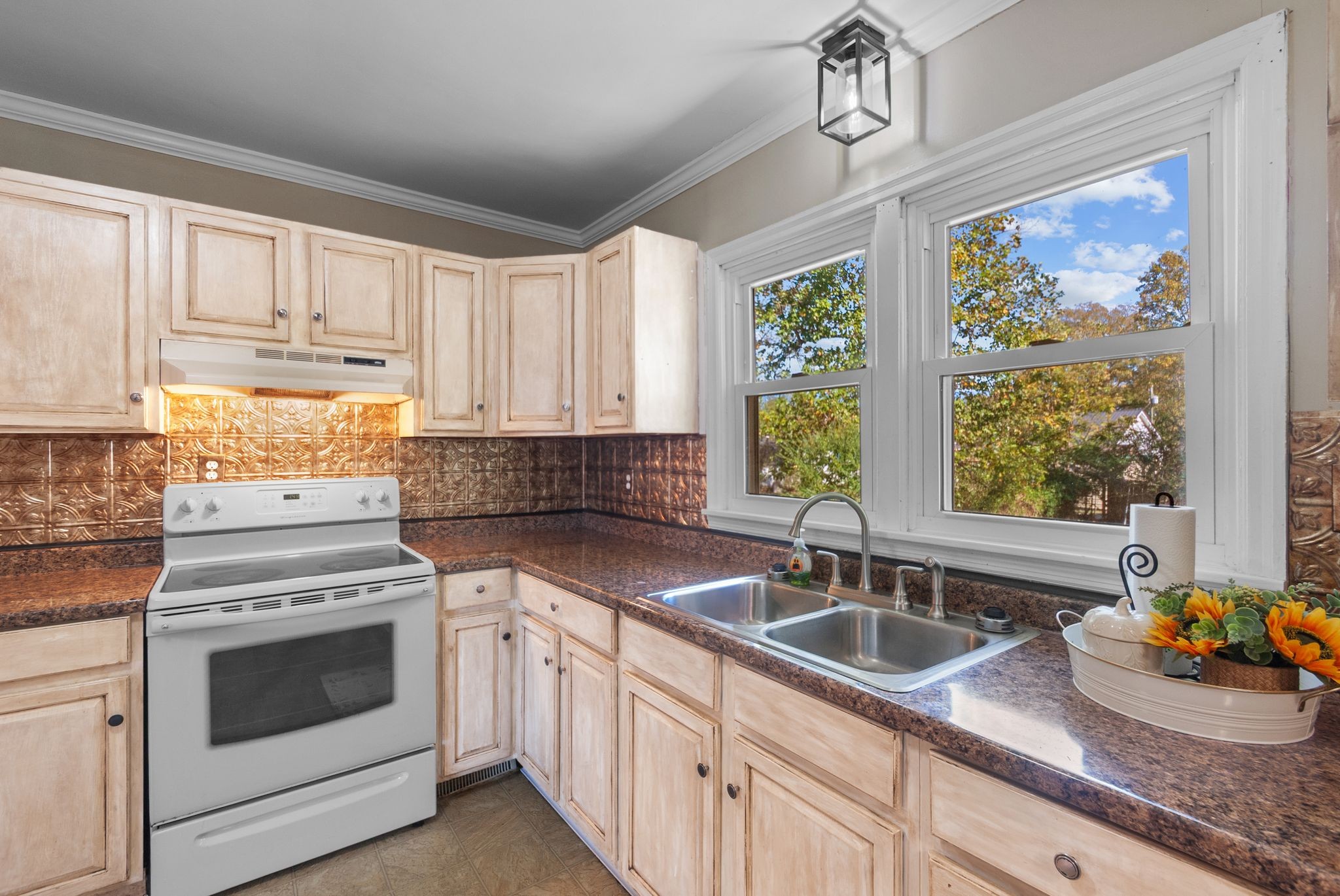 415 South Ingram Street Pulaski, TN 38478 - Photo 12 of 33 a kitchen with granite countertop a sink stainless steel appliances and cabinets