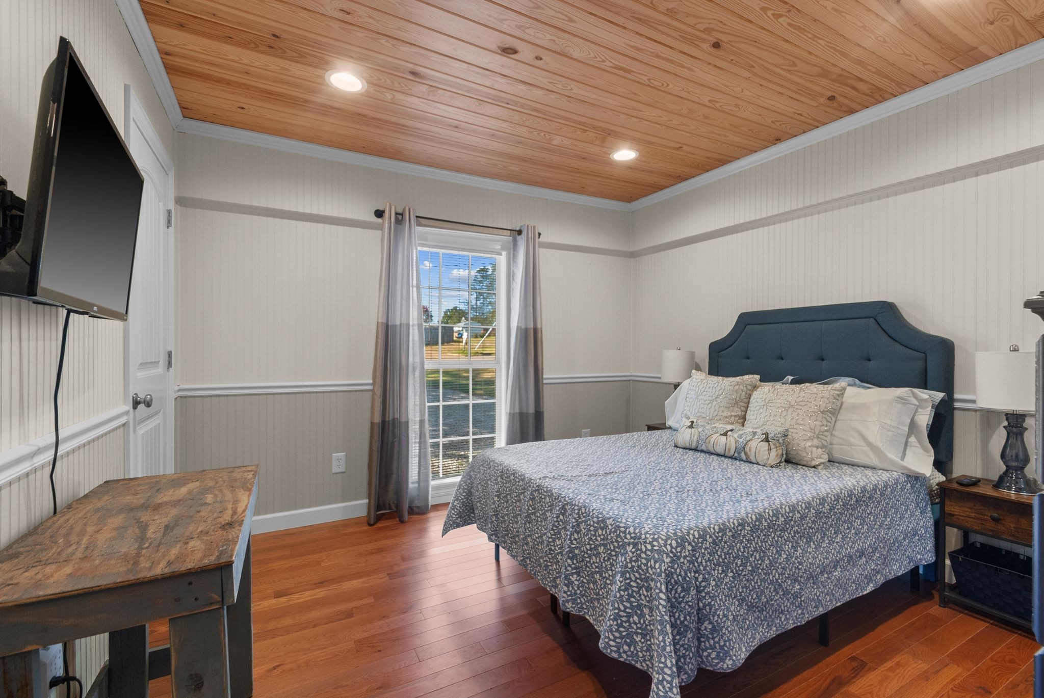 415 South Ingram Street Pulaski, TN 38478 - Photo 14 of 33 a bedroom with a bed and wooden floor